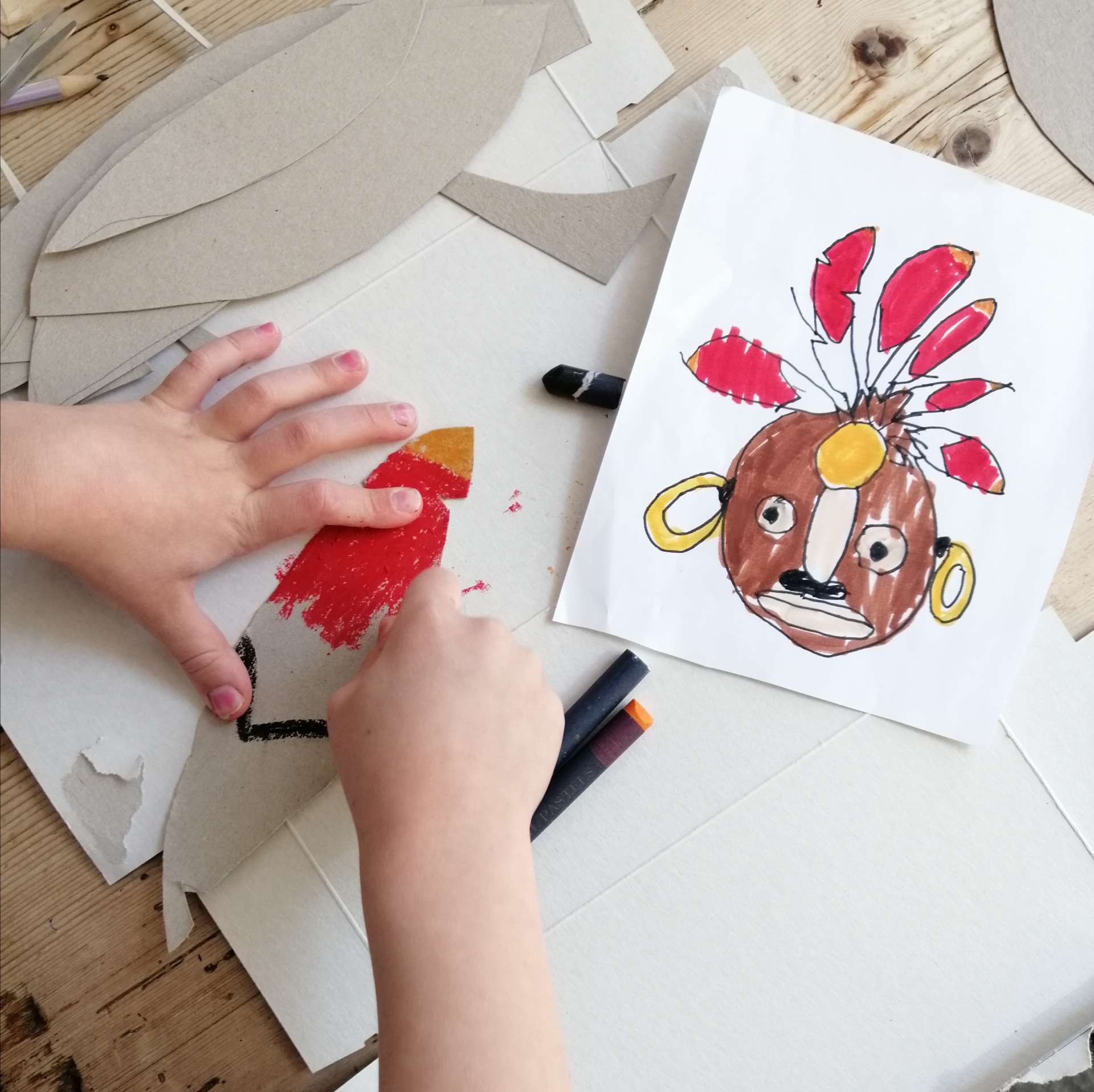 Colouring the feathers for our Mayan mask