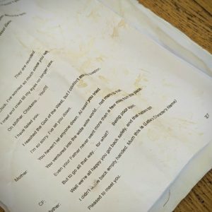 the image is of a paper script, that is all dog earred and stained.